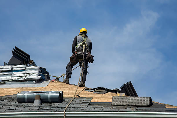 Professional Roofing technician working in Burket, IN